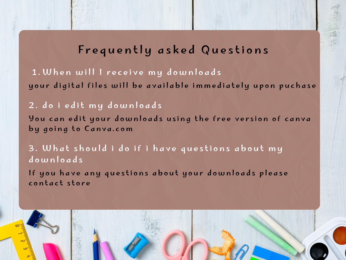 FAQ card with answers on a wooden surface with stationery items.
